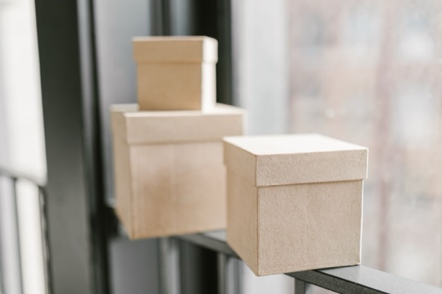 Photograph: plain boxes on a window sill