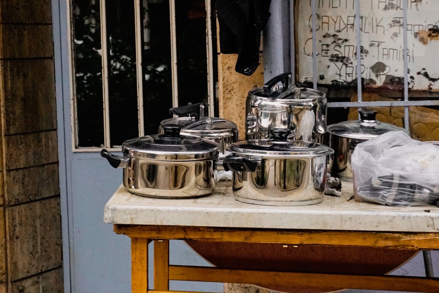 Photograph: metal pots at a street market in Turkey, imported-goods feel