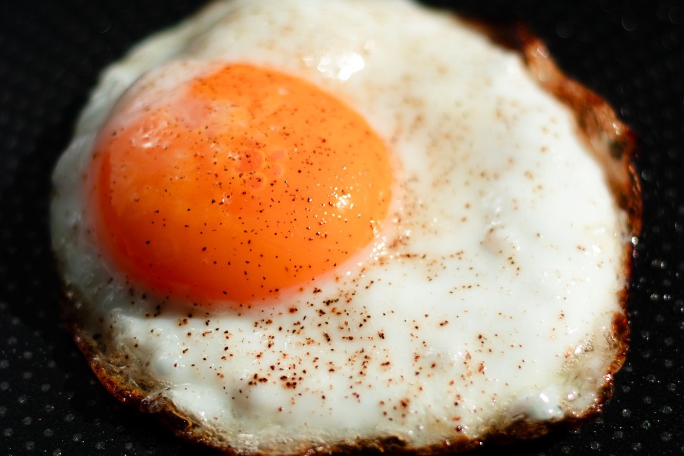Photograph: egg in a non-stick black pan