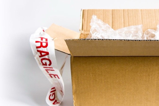Photograph: open box with bubble wrap, returns/cancel theme